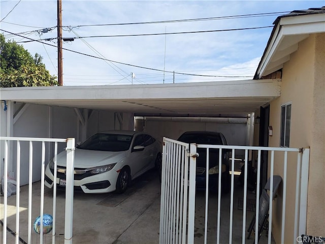 view of vehicle parking featuring a carport