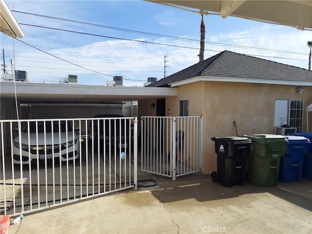 view of gate with a carport