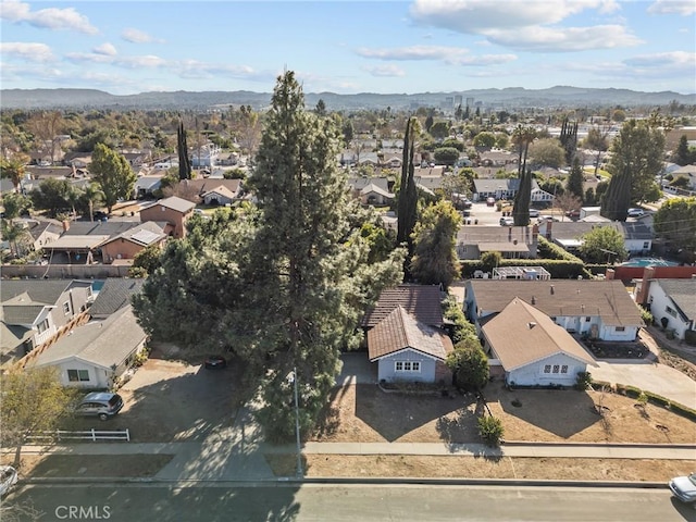 birds eye view of property featuring a mountain view