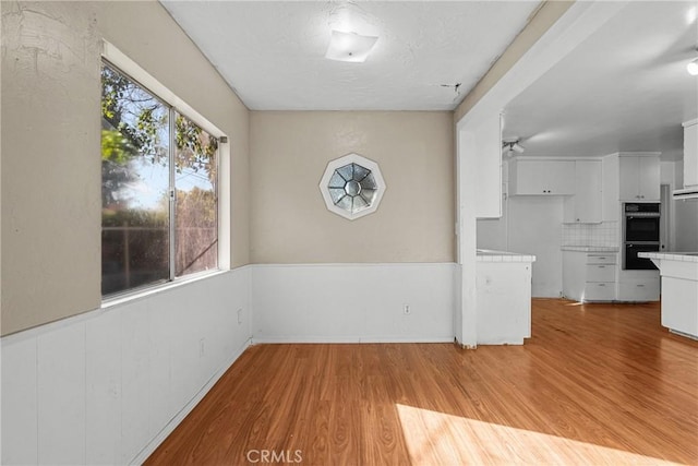 interior space with a healthy amount of sunlight and light hardwood / wood-style flooring