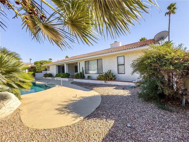 rear view of property with a patio