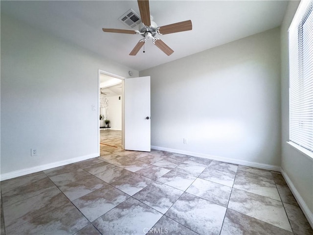 spare room featuring ceiling fan