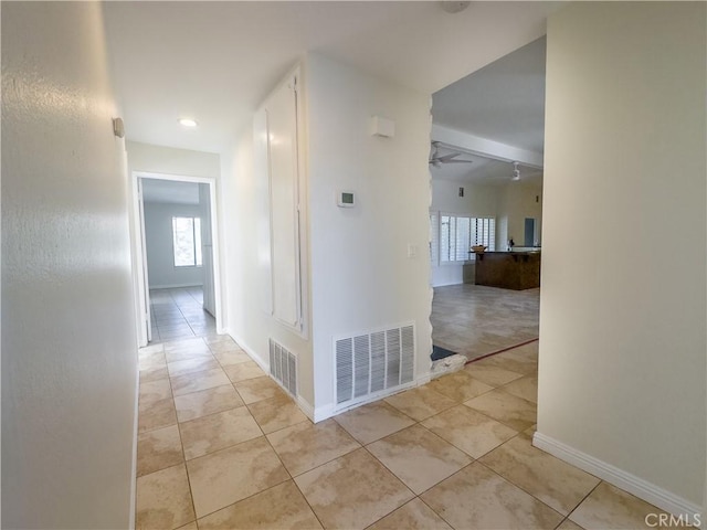 hall with light tile patterned flooring