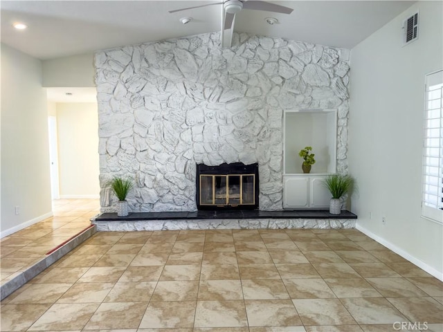 unfurnished living room with ceiling fan, vaulted ceiling with beams, tile patterned floors, and a fireplace