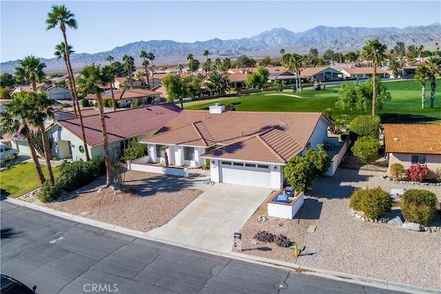 birds eye view of property with a mountain view