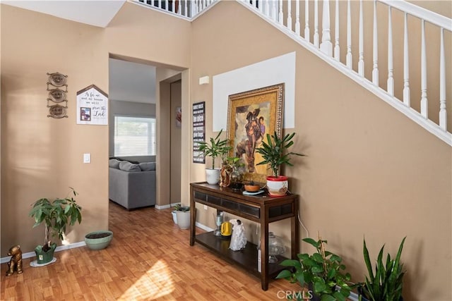 hall with hardwood / wood-style flooring