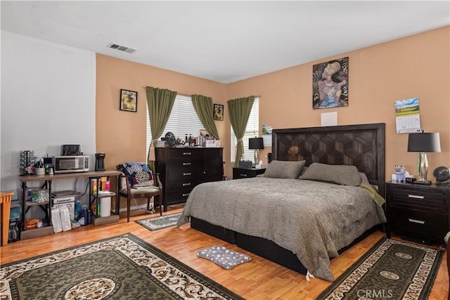 bedroom with light hardwood / wood-style floors