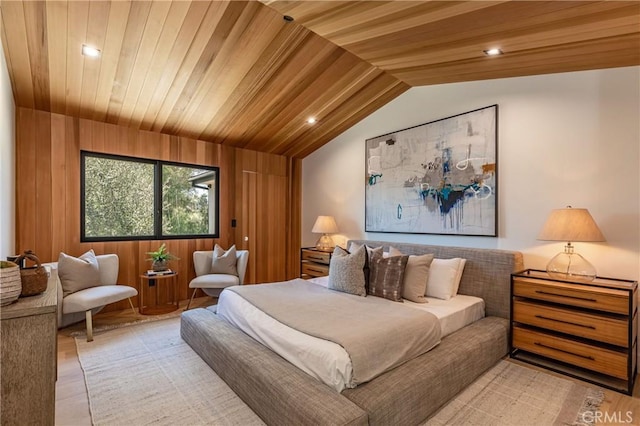 bedroom featuring light hardwood / wood-style floors, wood walls, lofted ceiling, and wooden ceiling