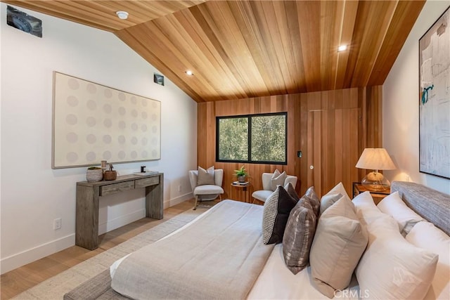 bedroom featuring wooden ceiling, lofted ceiling, and light hardwood / wood-style floors