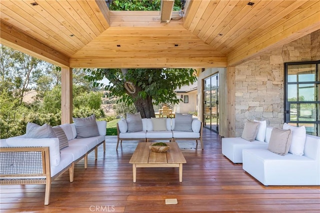 sunroom with wood ceiling and lofted ceiling