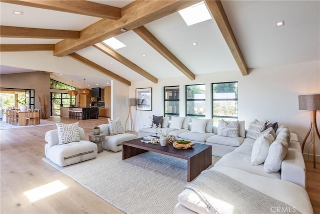 living room featuring hardwood / wood-style floors and vaulted ceiling with beams