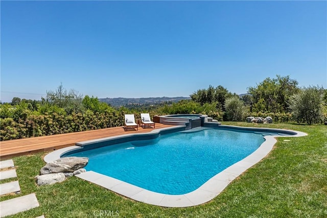 view of pool with a lawn