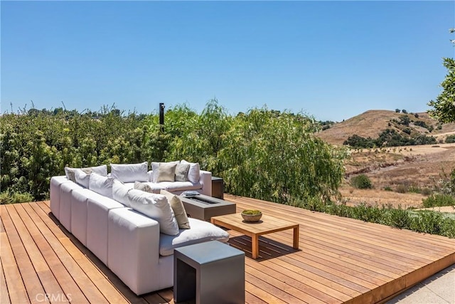 deck featuring outdoor lounge area