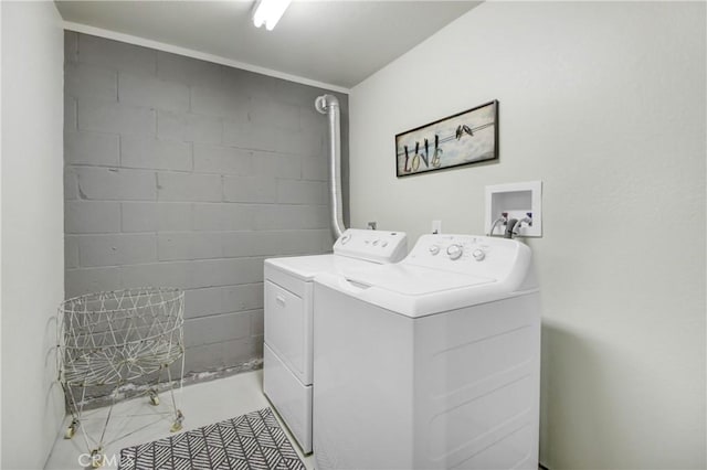 washroom featuring light tile patterned flooring and separate washer and dryer