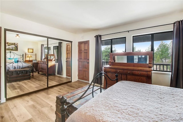 bedroom with wood-type flooring and a closet