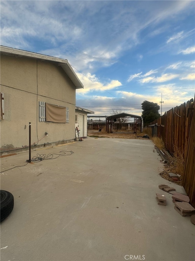 view of home's exterior featuring fence and stucco siding