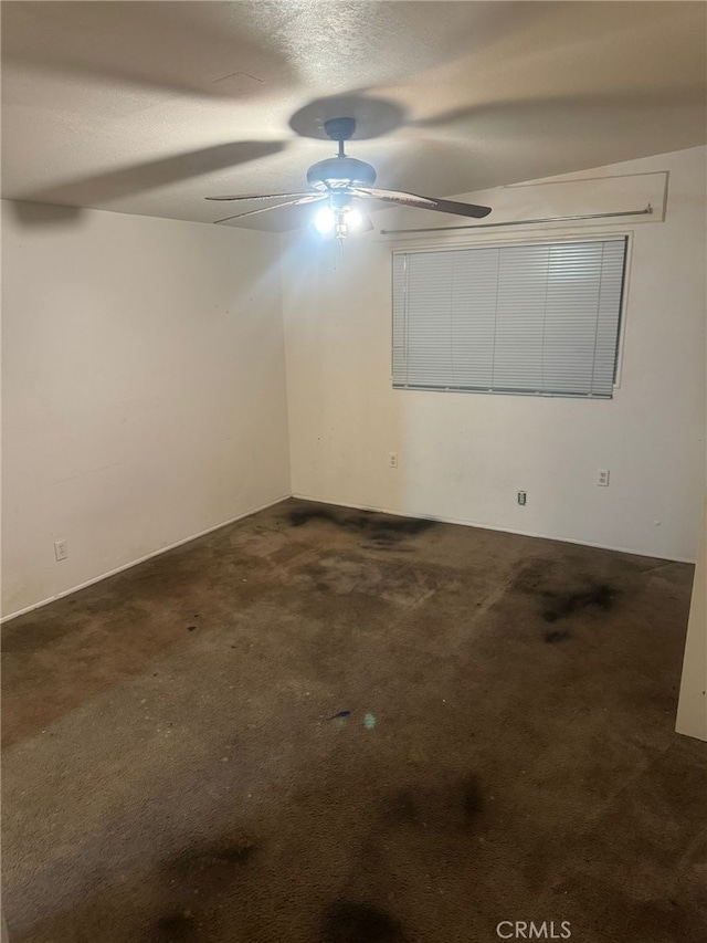 unfurnished room with carpet floors, a textured ceiling, and a ceiling fan