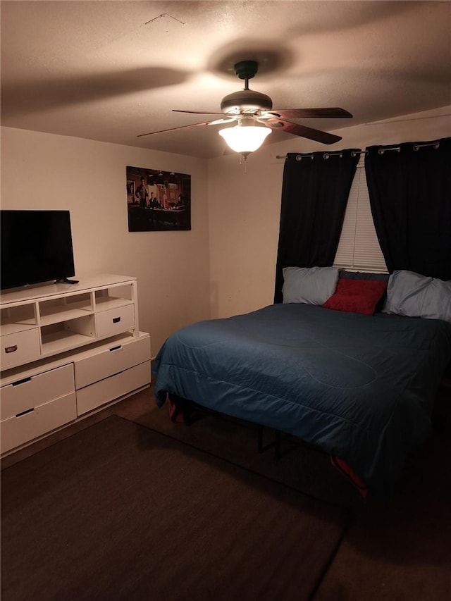 bedroom with a ceiling fan and wood finished floors