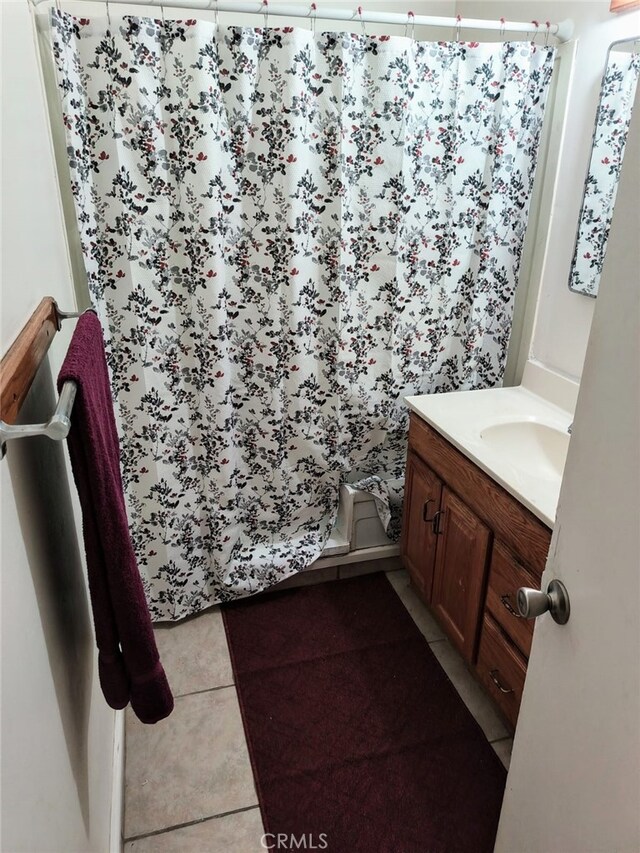 24144 Joshua Ave, Boron, CA 93516 - full bathroom featuring a shower with shower curtain, tile patterned floors, and vanity