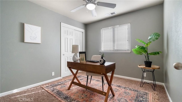 home office with ceiling fan and carpet flooring