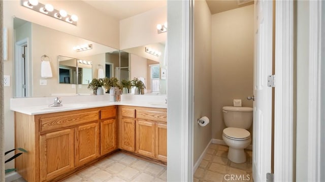 bathroom featuring toilet and vanity