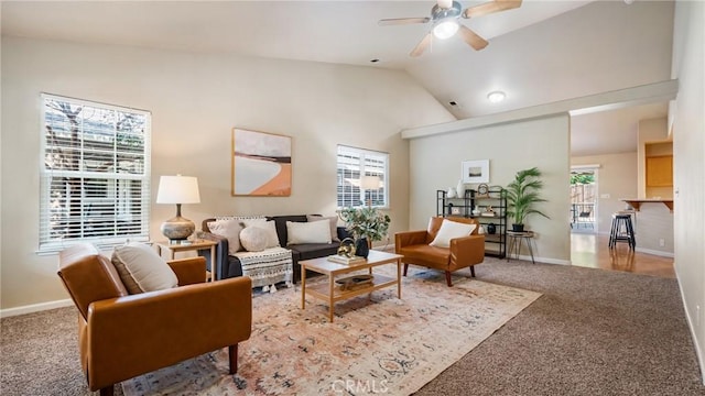 living room featuring lofted ceiling, light colored carpet, ceiling fan, and plenty of natural light