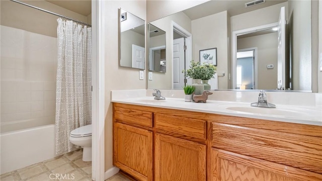 full bathroom with toilet, vanity, and shower / bath combo with shower curtain