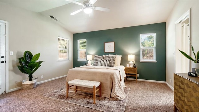 carpeted bedroom featuring vaulted ceiling, ceiling fan, and multiple windows