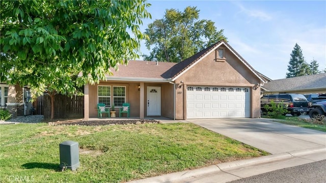 ranch-style home with a front lawn, covered porch, and a garage