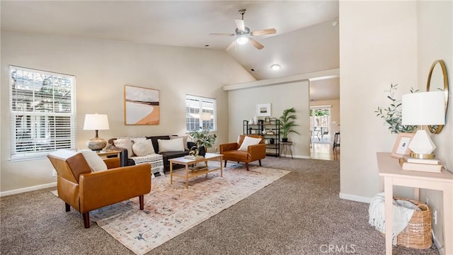 carpeted living room featuring ceiling fan and vaulted ceiling