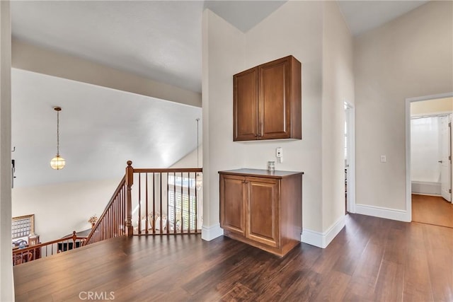 hall with dark hardwood / wood-style flooring