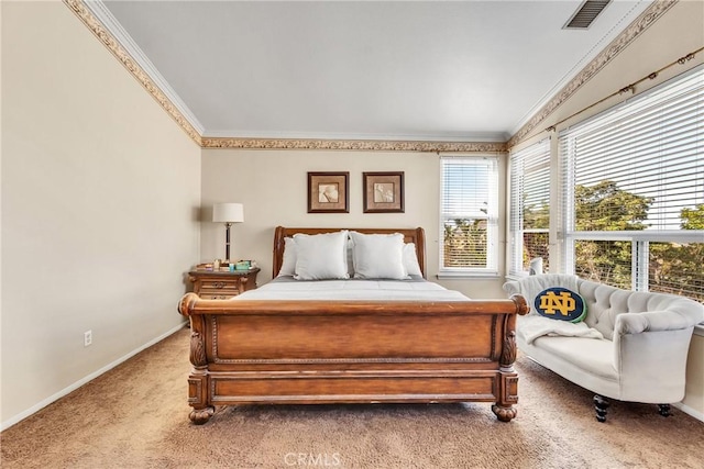 bedroom with crown molding and carpet floors