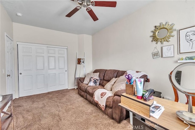 living room featuring ceiling fan and light colored carpet