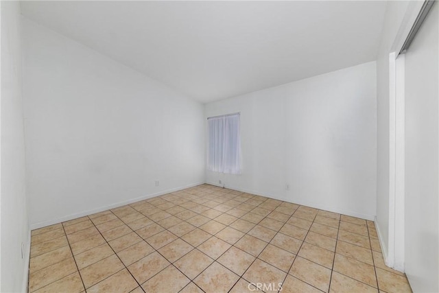 empty room with light tile patterned floors