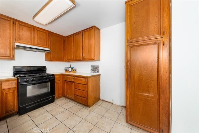 kitchen featuring black range with gas stovetop and light tile patterned flooring