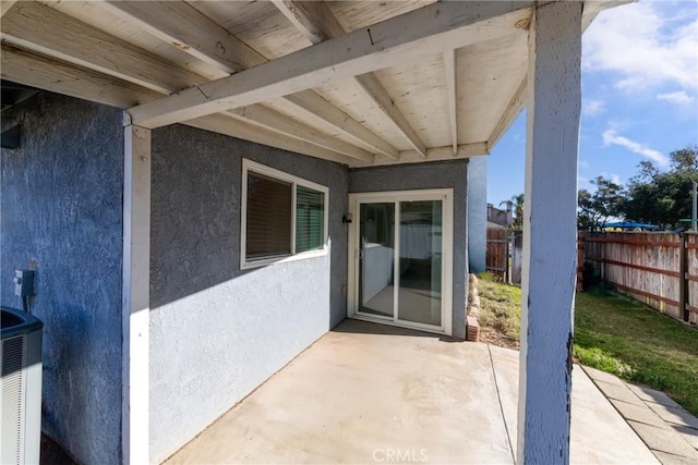 entrance to property featuring a patio area