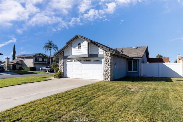 view of front of property with a garage and a front yard