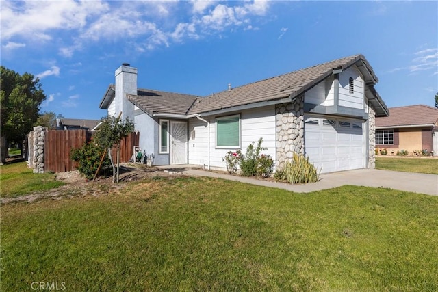 single story home with a front yard and a garage