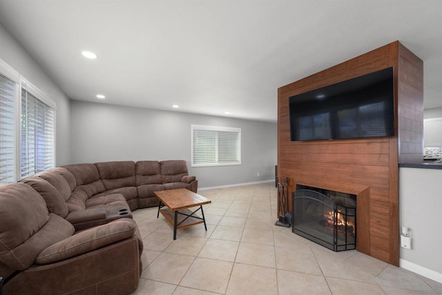 tiled living room featuring a fireplace