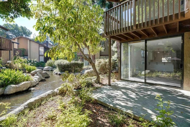 view of yard featuring a wooden deck