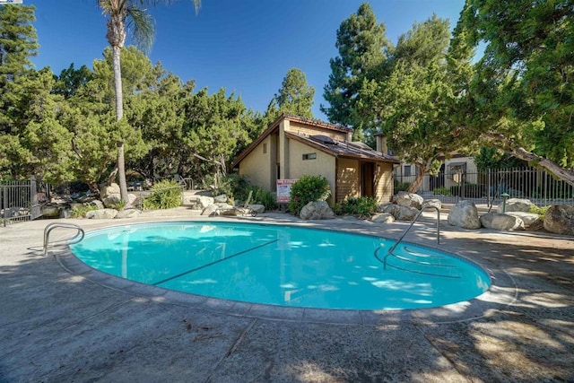 view of swimming pool featuring a patio