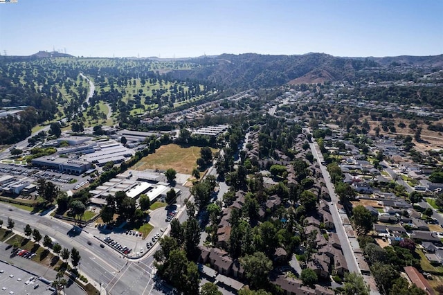 birds eye view of property featuring a mountain view