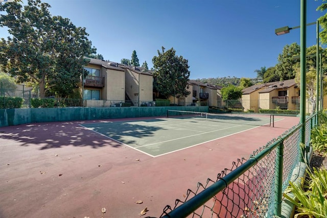 view of tennis court with basketball court