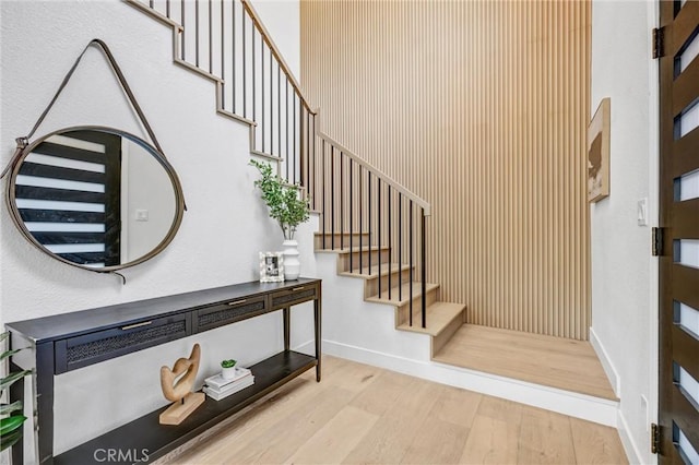 stairway featuring hardwood / wood-style flooring