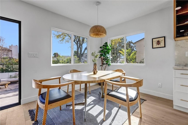 dining area featuring light wood-type flooring