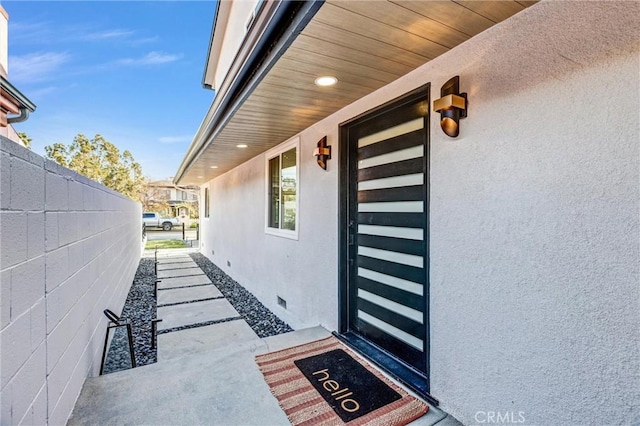 view of exterior entry featuring a porch