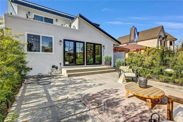 rear view of house featuring a patio area