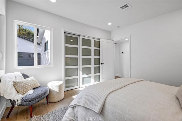 bedroom with light hardwood / wood-style floors