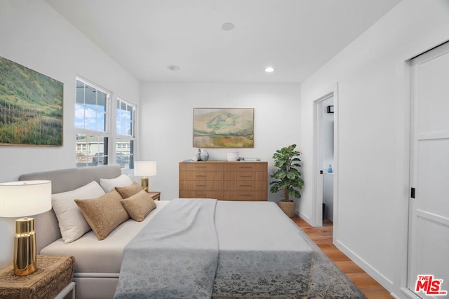 bedroom with light hardwood / wood-style floors