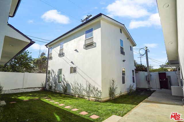 back of house with a yard